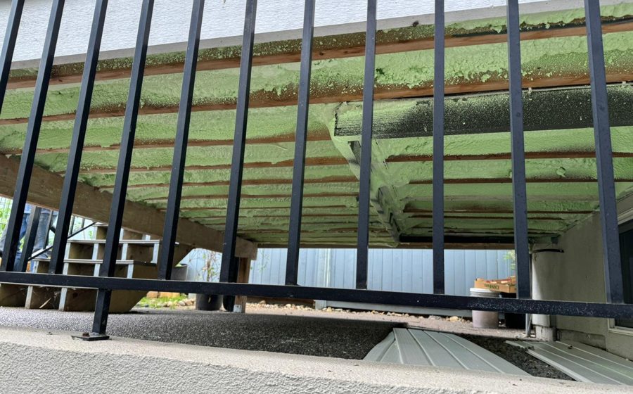 Steel-stud framing with sprayed assembly behind